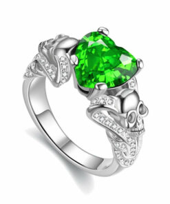 Skull engagement ring for women with two skulls and a green stone in shape of a heart